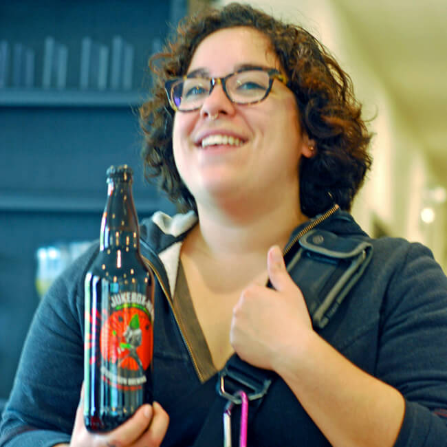 Chicago Food Planet Tour Guide holding Chicago microbrewery beer; Wicker Park Bucktown Food Tour