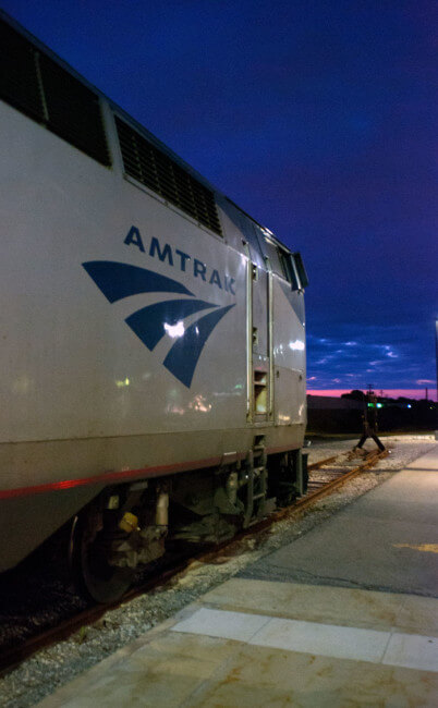 Amtrak train engine with sunrise