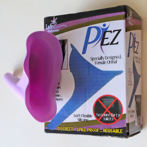 the P EZ female urinary device beside the box it came in