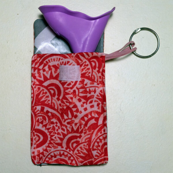 the P EZ female urinary device in a handmade waterproof bag