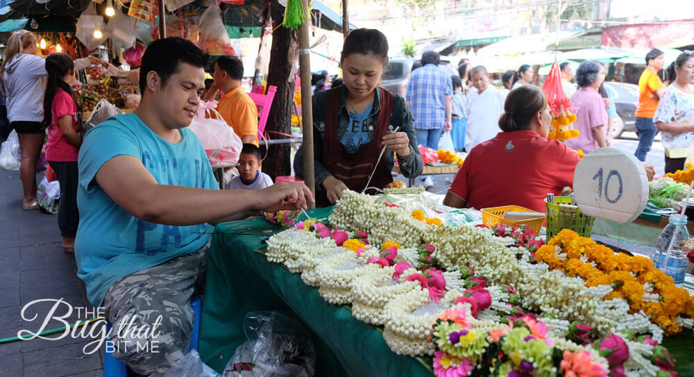 a couple works at their flower stall
