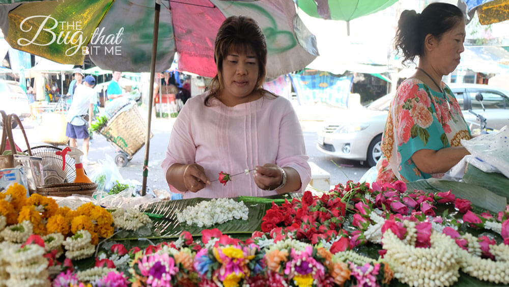 a flower vendor makes offerings