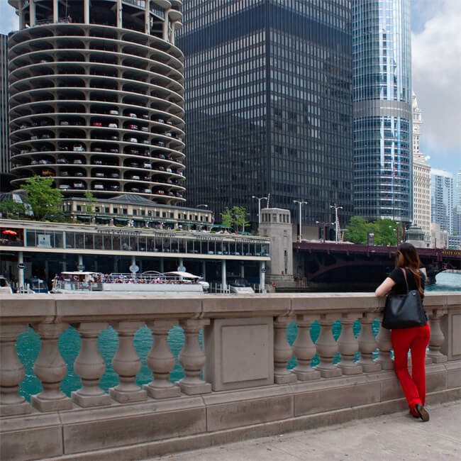 woman looks out at Chicago River