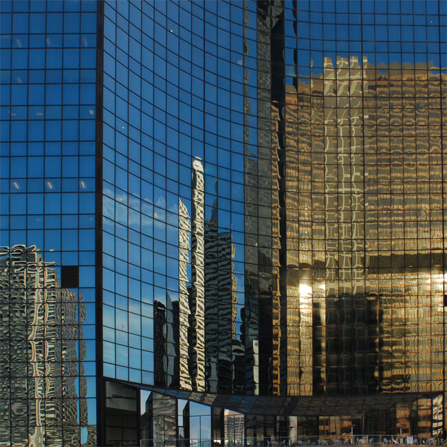 skyscrapers reflected in a glass building, Chicago