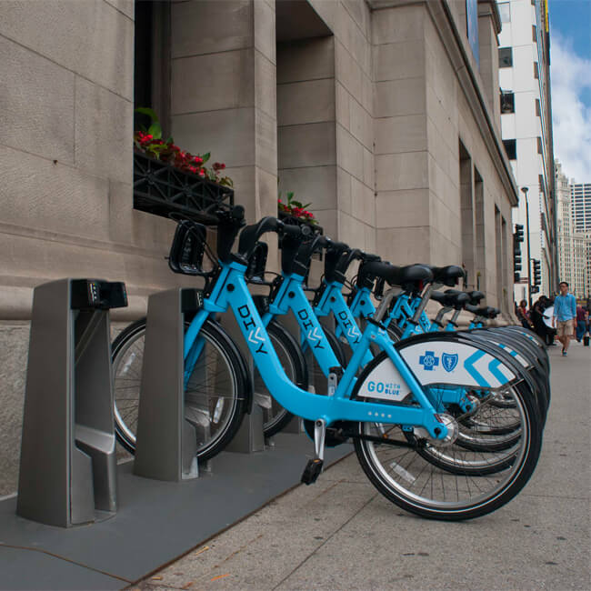 a row of blue rental bikes, Chicago