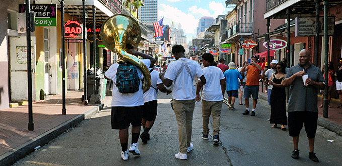 4-piece jazz band plays as they move along Bourbon Street